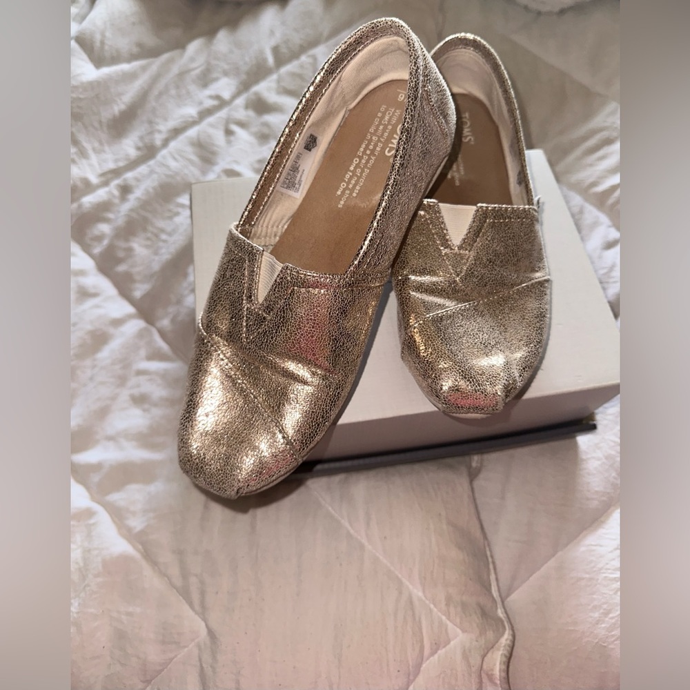 Gold TOMS women’s shoes